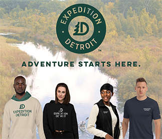 Four diverse models wearing an Expedition Detroit shirt, sweatshirt and vest